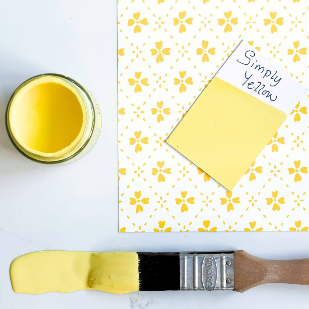Yellow patterned wallpaper and brush dipped in 120ml pot of Blake & Taylor Simply Yellow Chalk Furniture Paint