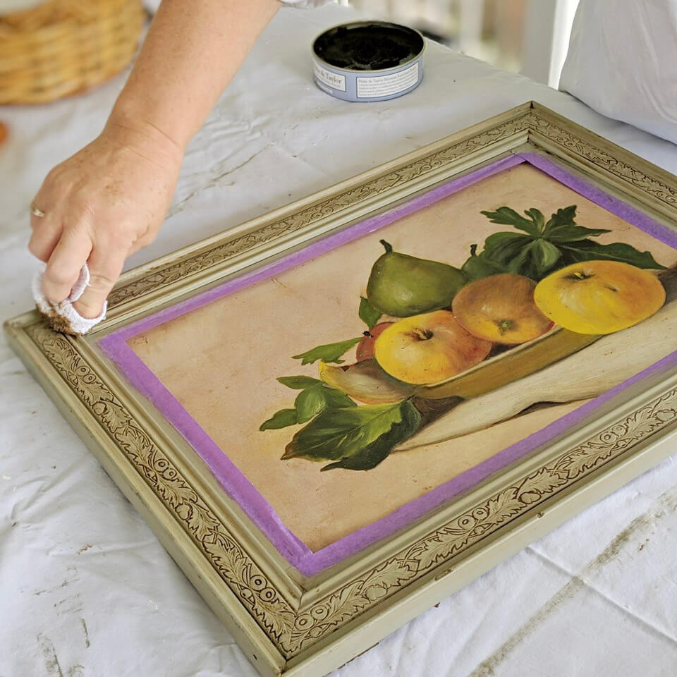 Vintage carved frame with Blake & Taylor Soft Black Wax being applied