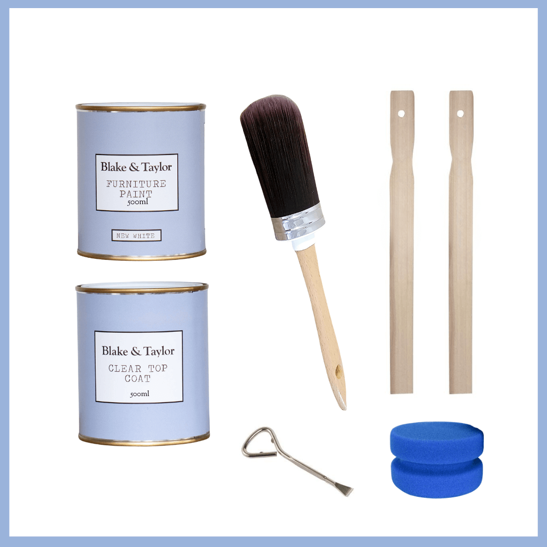 Furniture painting kit with cans, brush, sticks, and other tools on a white background