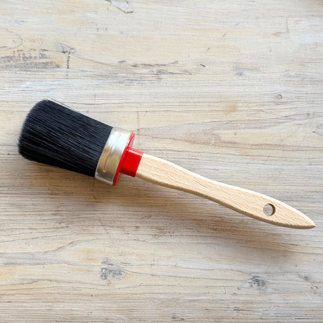 Chalk Painting brush on timber background