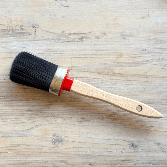 Chalk Painting brush on timber background