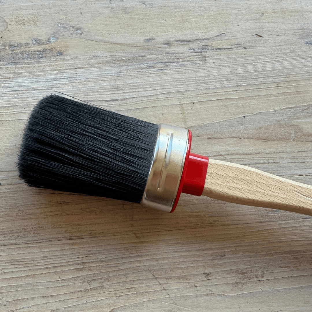 Chalk Painting brush on timber background