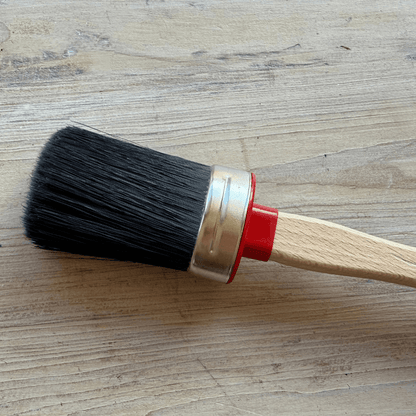 Chalk Painting brush on timber background