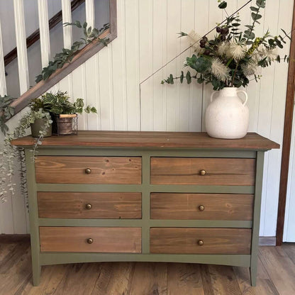wooden dresser painted with Blake & Taylor Furniture Paint, colour Elowen, with six drawers and natural brown wood drawer fronts and top.