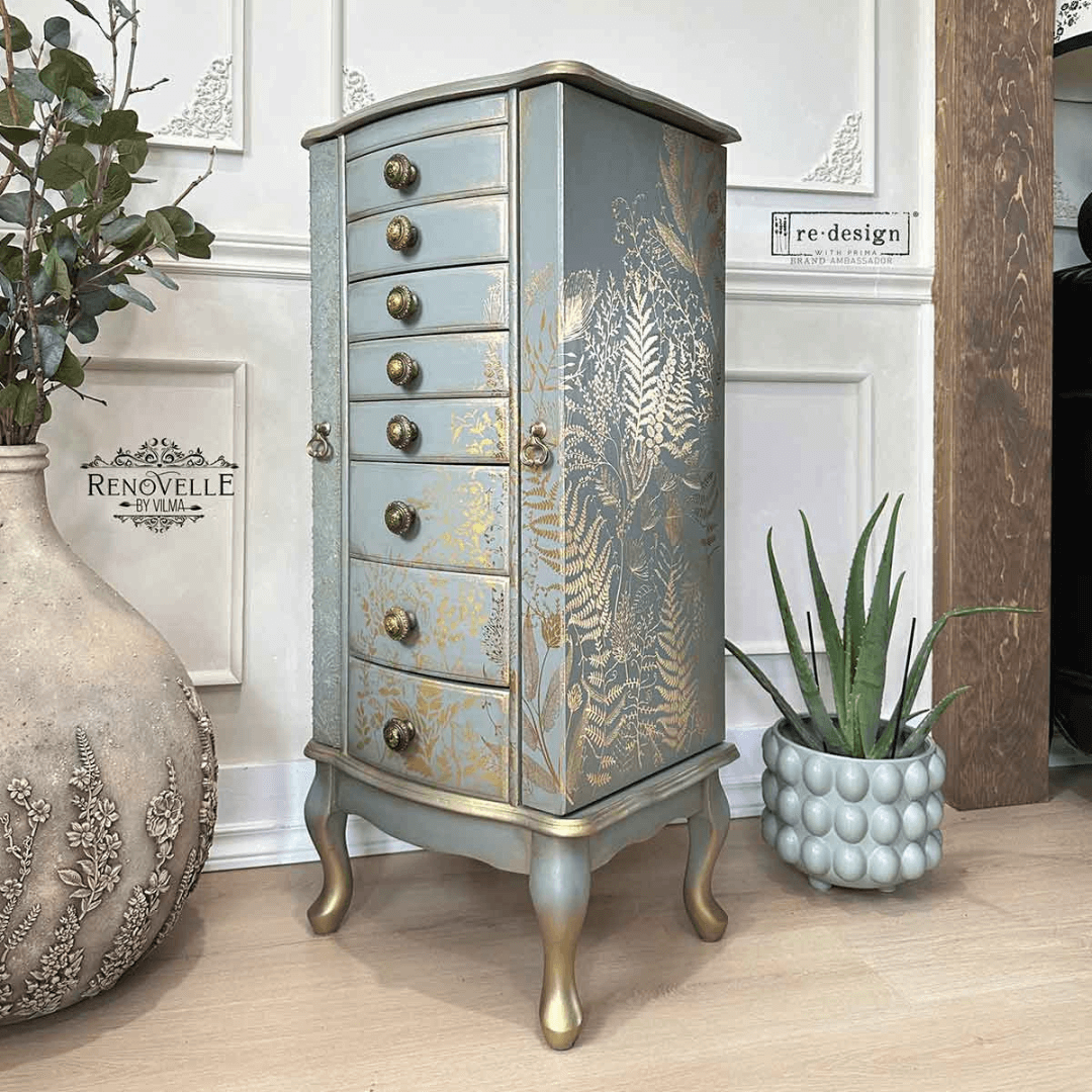 Decorative jewelry cabinet with floral patterns in a room setting