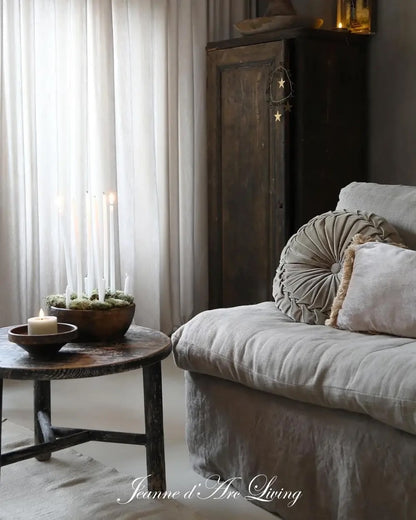 Cozy living room with a sofa, small table, and decorative elements.