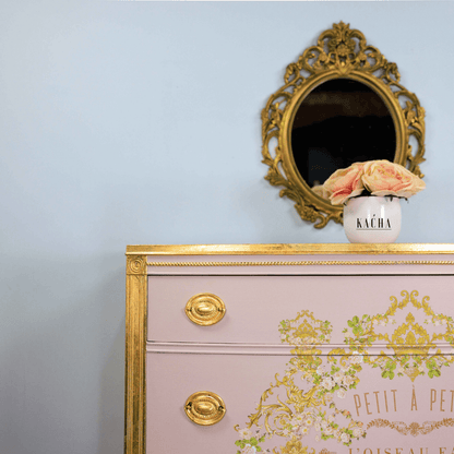 Set of drawers with trim detail and handles decorated with gold leaf 