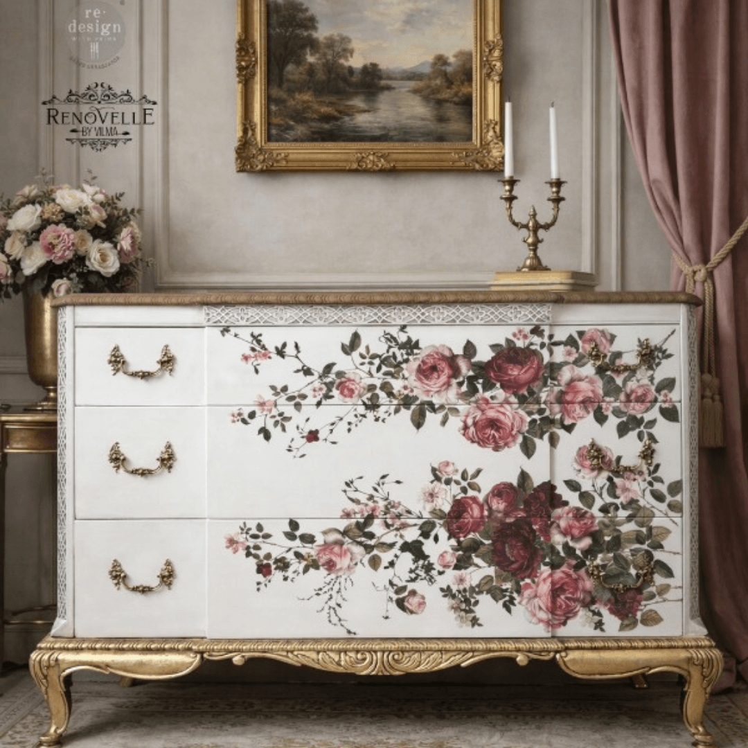 Decorative chest of drawers with floral design in a classical room setting.
