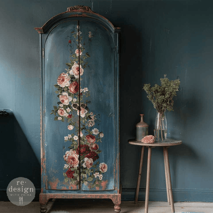 Decorative cabinet with floral design against a dark blue wall