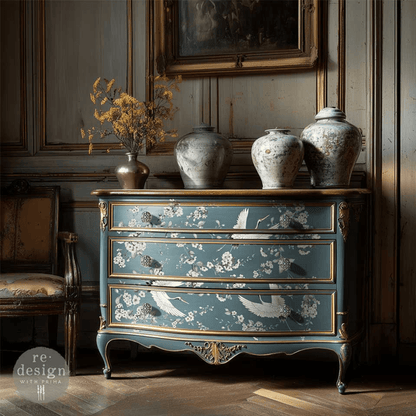 Dark green chest of drawrs decorated with Decor transfer of asian crane birds and white cherry blossom