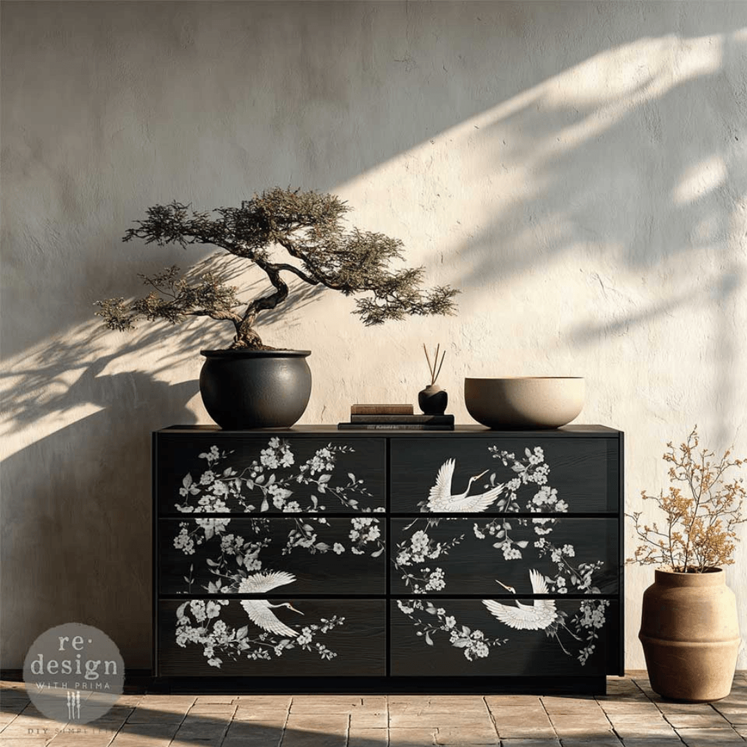 Black chest of drawrs decorated with Decor transfer of asian crane birds and white cherry blossom