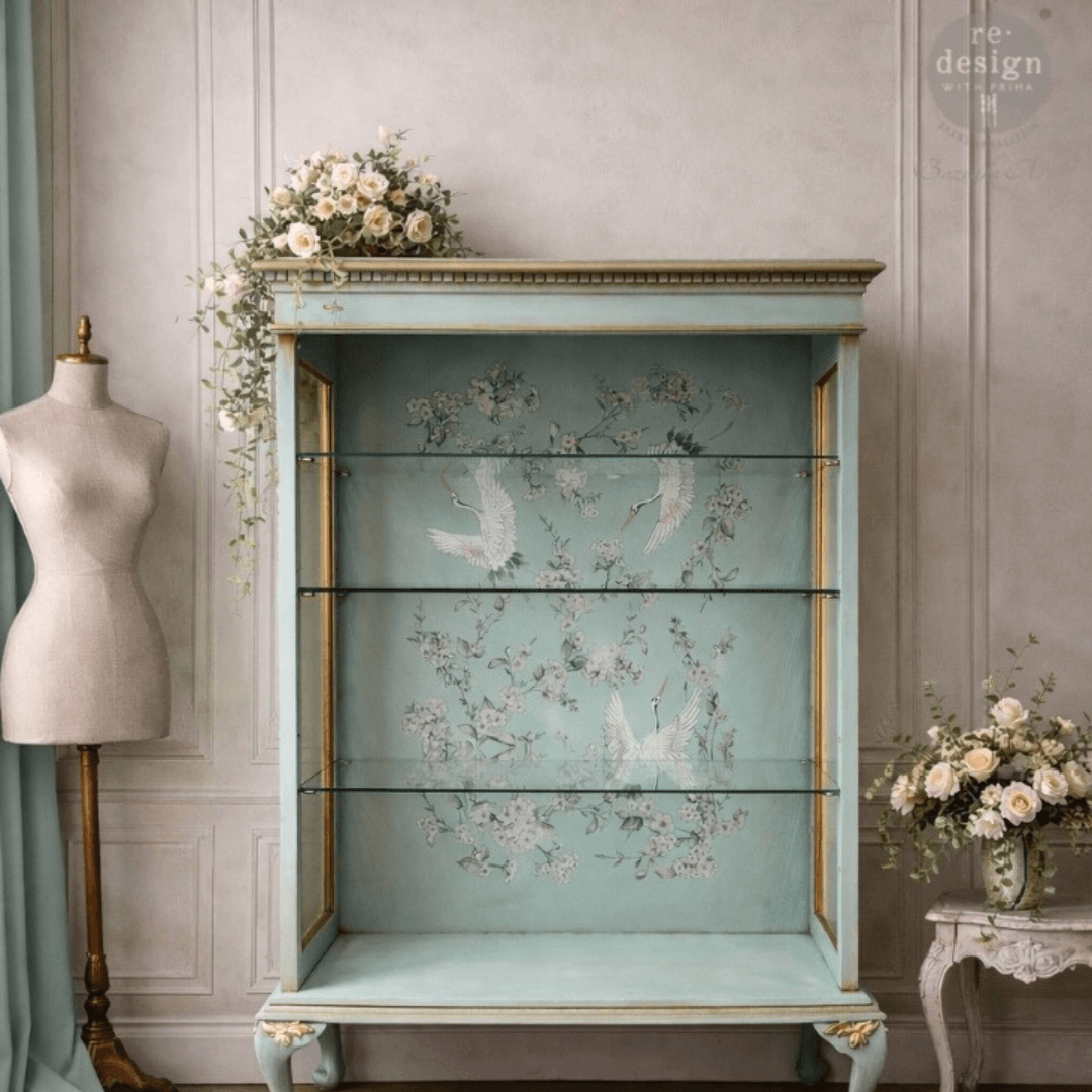 Light green cabinet decorated with Decor transfer of asian crane birds and white cherry blossom
