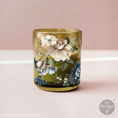 Decorative glass with floral design on a pink background
