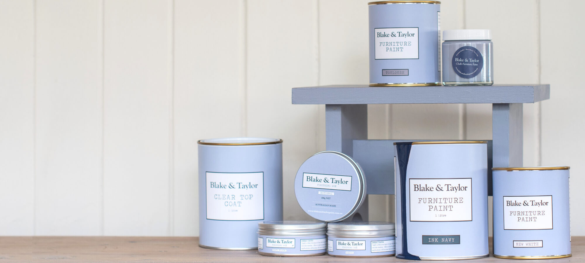 Collection of Blake & Taylor Chalk Furniture Paint tins, sample pots and furniture wax with timber stool