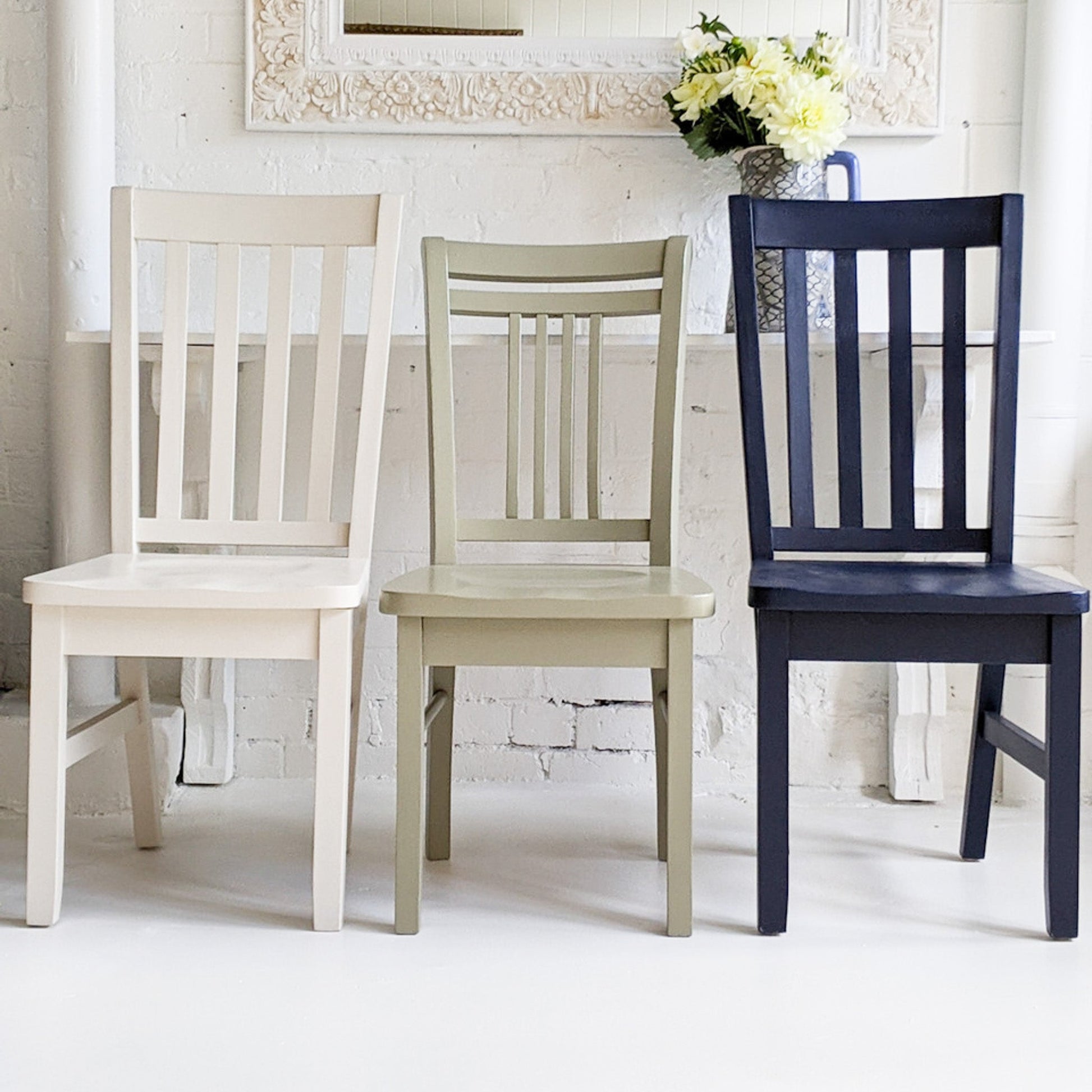 three timber chairs painted Ink Navy, Sage and Hampton using Blake & Taylor Chalk Furniture Paint