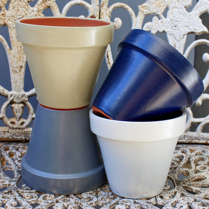 Four terracotta pots painted colours Sage, Ink Navy, Steel Grey and Dove Grey using Blake & Taylor Chalk Furniture Paint