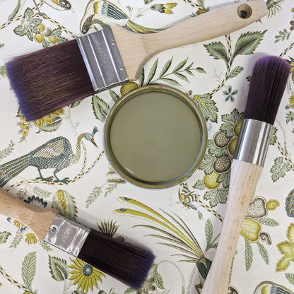 Green patterned wallpaper with Sage Blake & Taylor Paint tin lid