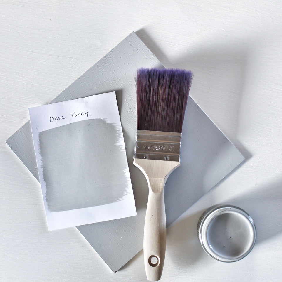 Paintbrush and colour swatches of Blake & Taylor Dove Grey Chalk Furniture Paint
